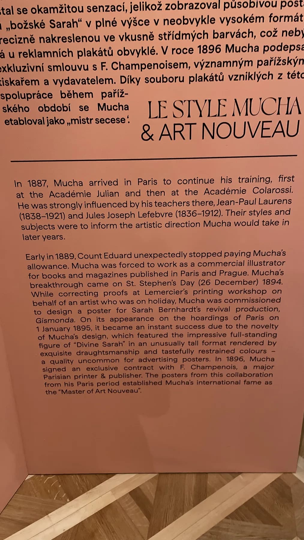 Museum wall panel titled Le Style Mucha and Art Nouveau explaining Mucha's Paris period and the 1894 Gismonda poster.